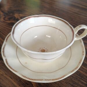 Elegant Cream and Brown Teacup and Saucer Set